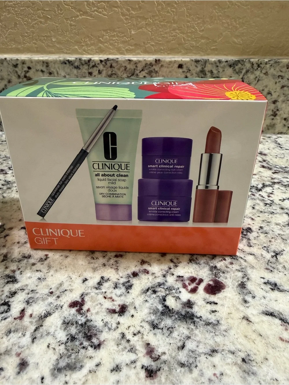 Clinique Makeup Set with Purple Floral Cosmetic Bag & extra lipstick / liner